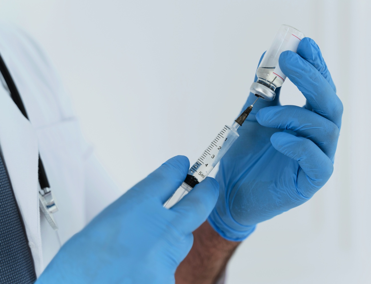 doctor-holding-syringe-close-up
